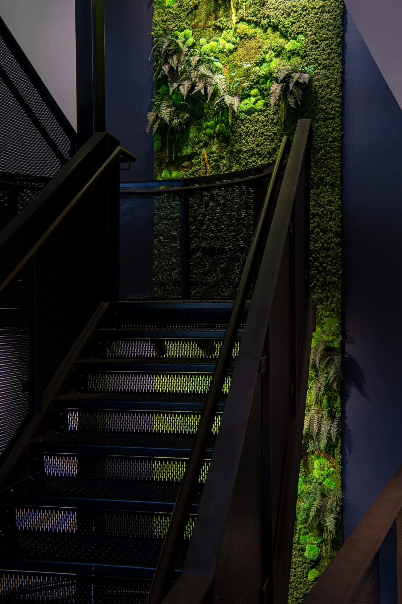 Workplace well-being and productivity: a modern office with natural light and ergonomic furniture.